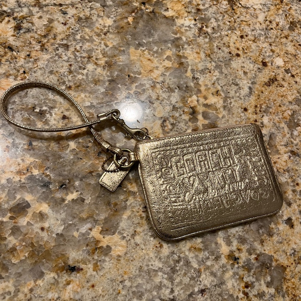Gold metallic Coach wristlet